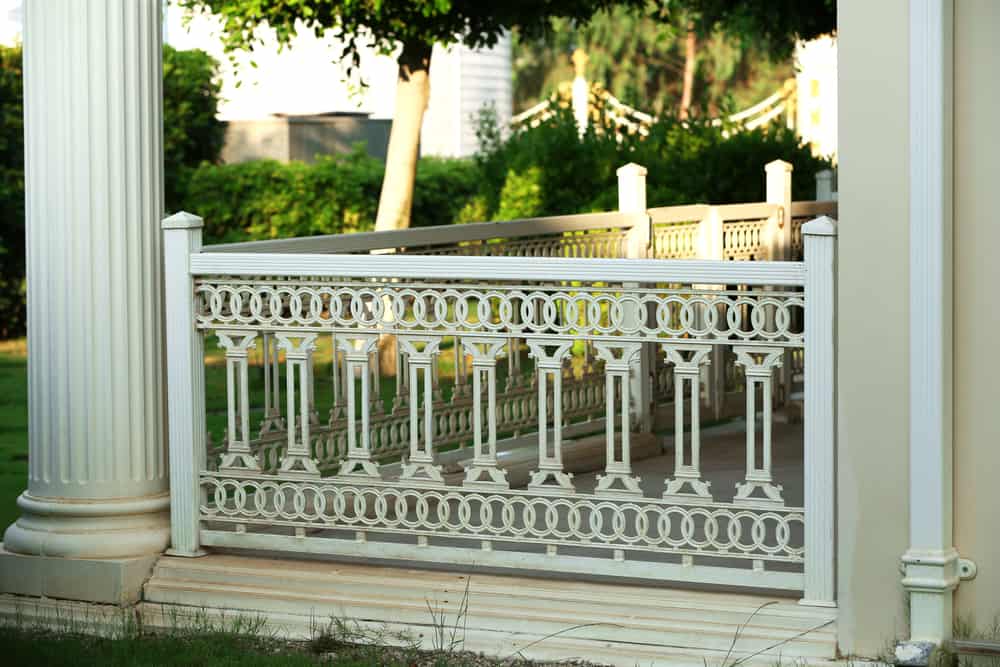 intricate wood porch railing 