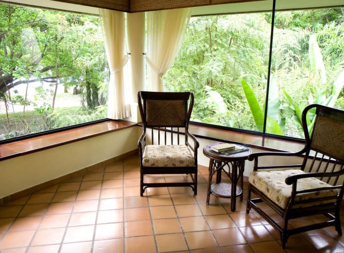 screened in porch with window seats